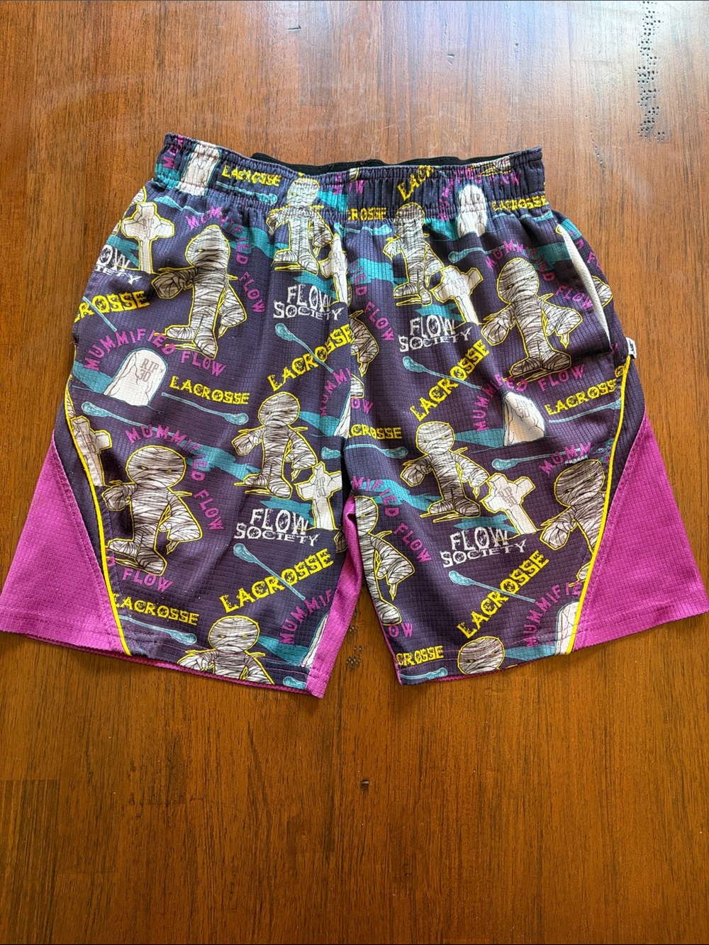 Purple Mummy Lacrosse Graphic Shorts with Yellow Accents